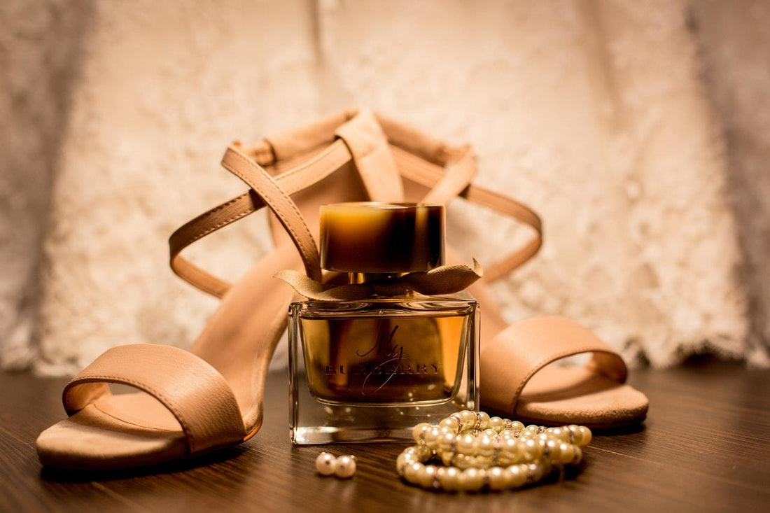 a pair of sandal and perfume