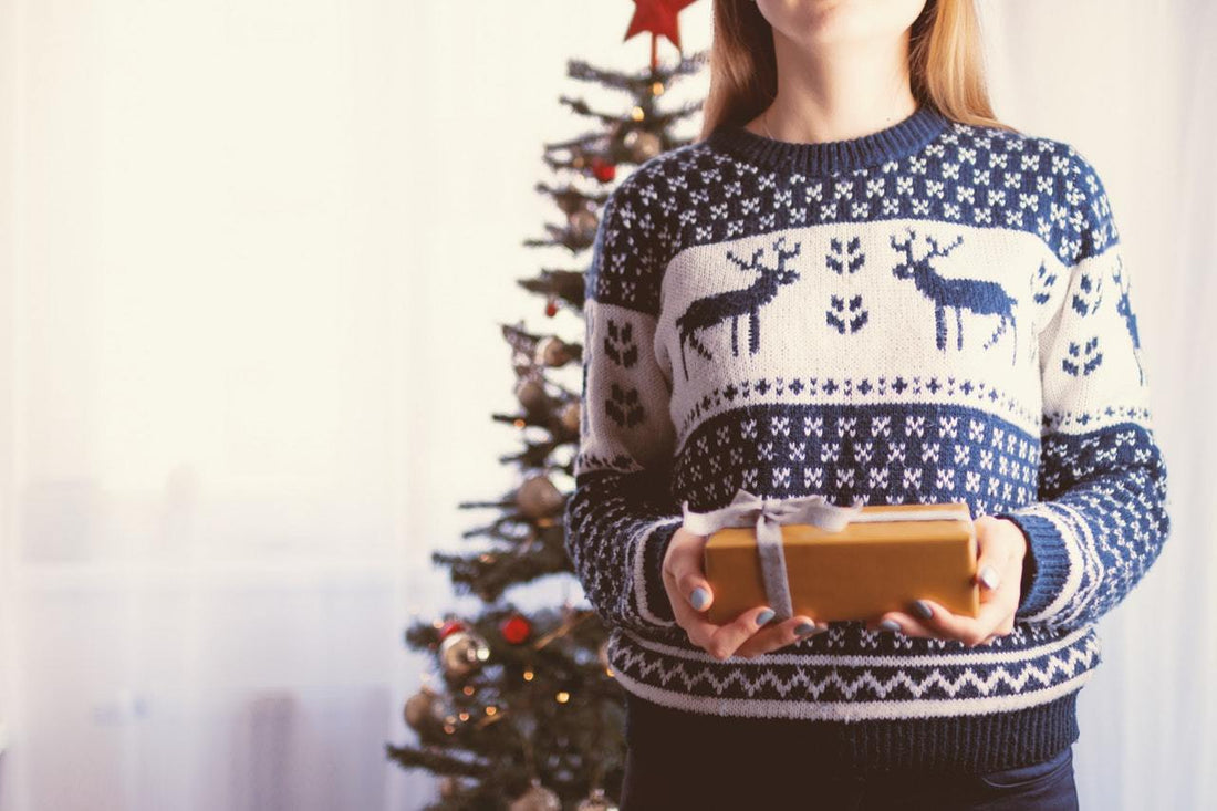 woman wearing christmas themed sweater