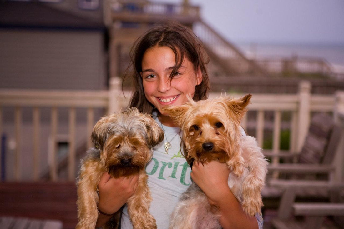 girl holding her pets