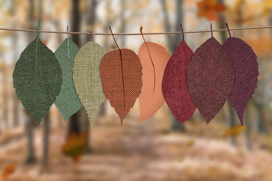 leaves of different shades hanging on a rope