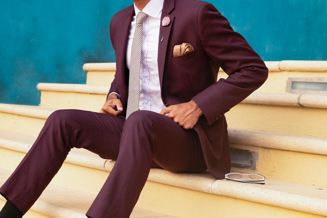 man sitting wearing a suit