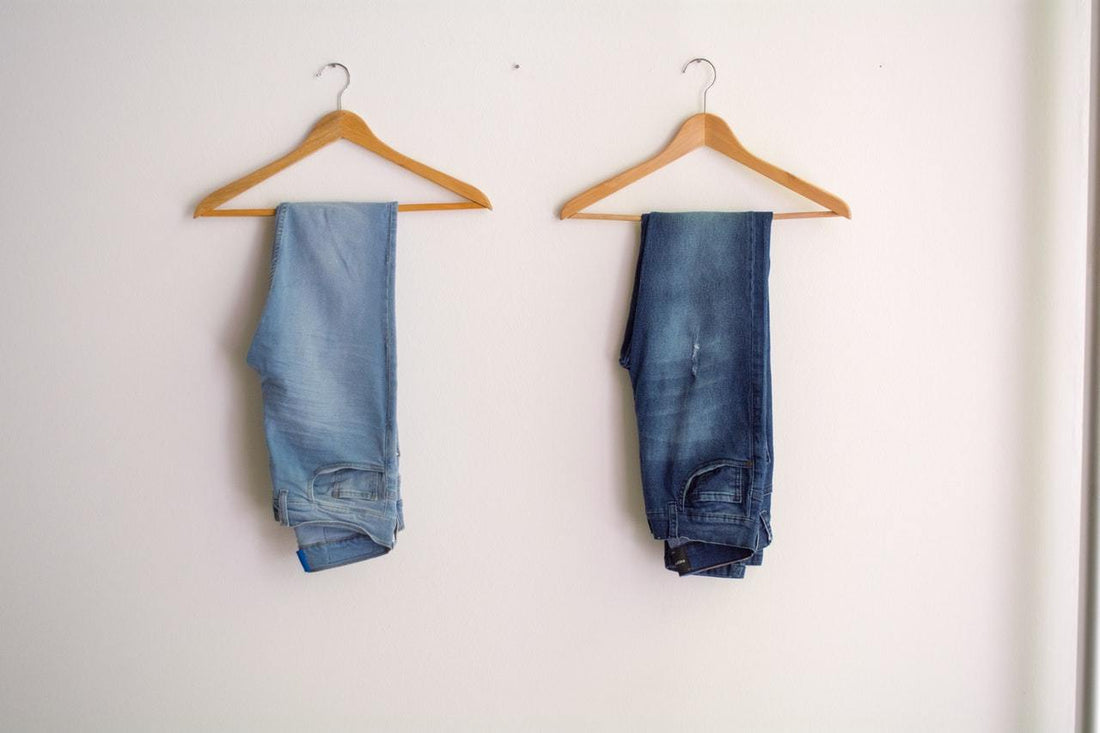 two jeans on hangers